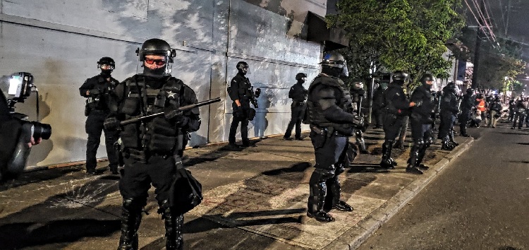 Police Guard the PPA in riot gear. (Photo by Mac Smiff)